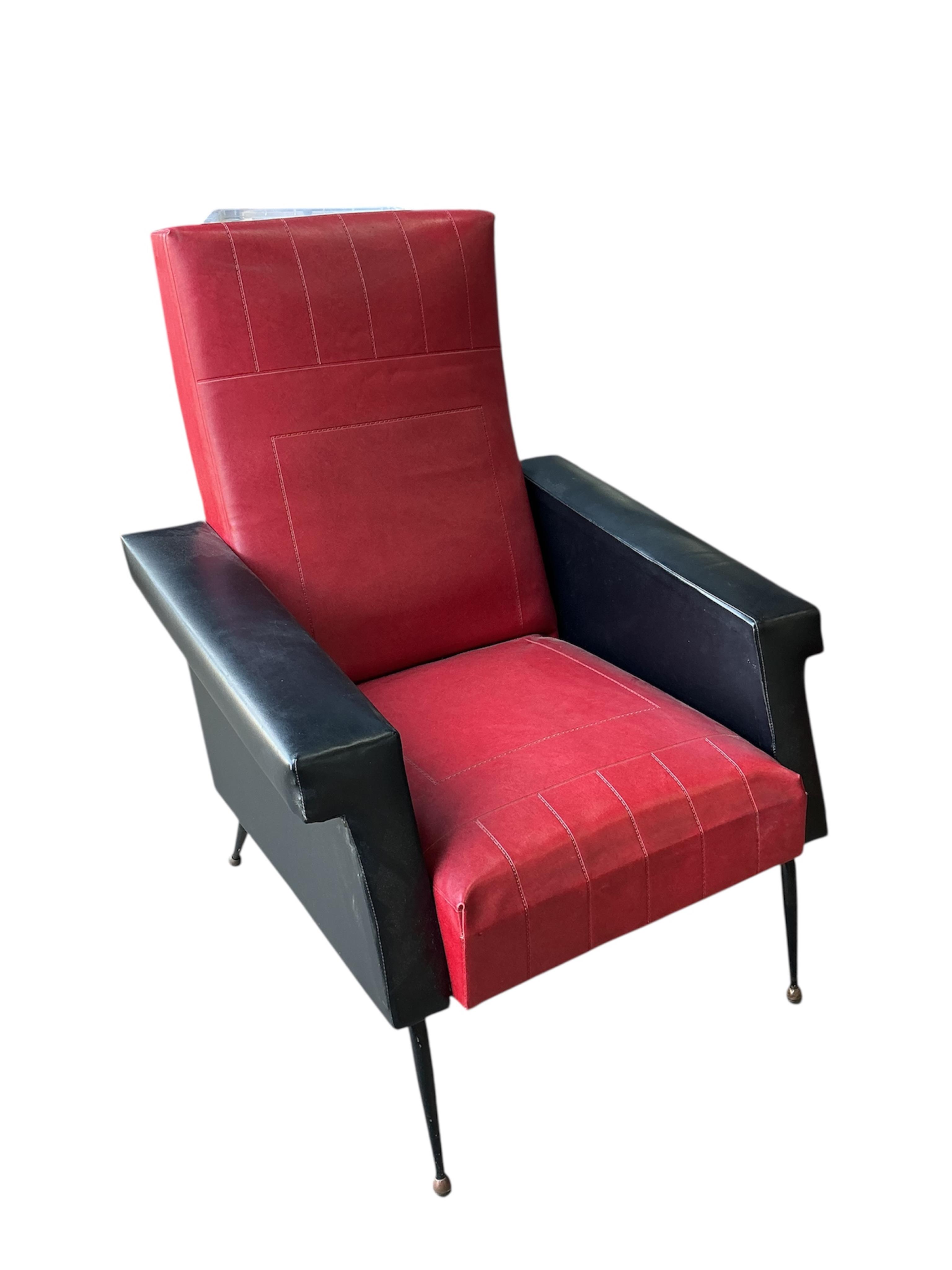 A pair of 1970's leatherette armchairs, width 74cm, depth 78cm, height 93cm
